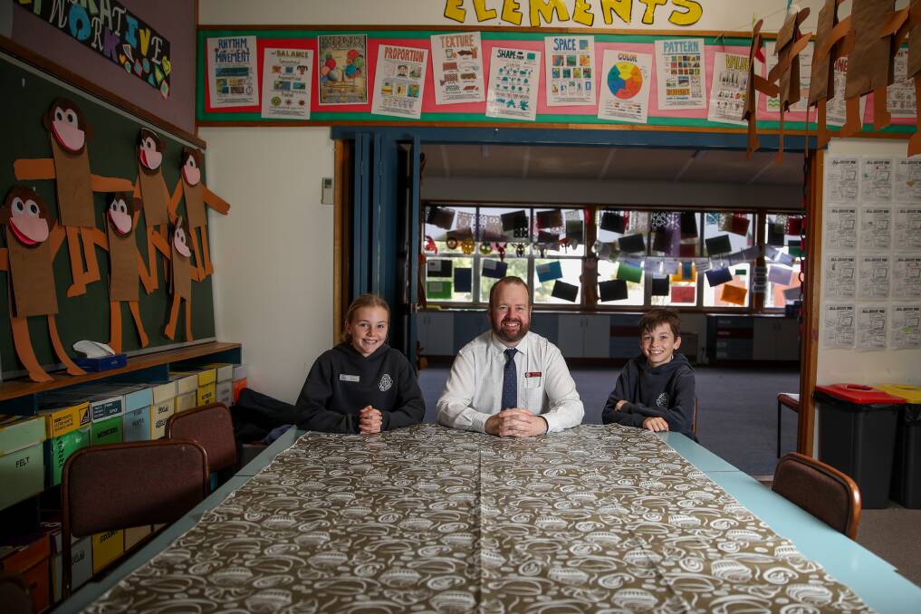 Overdue: St Pius X Parish School principal Joe Ewing, pictured with school captains Molly Bermingham and Harry Woodward, is excited the school's year 3-4 area will finally be redeveloped and brought up-to-date with the junior and senior areas. Picture: Morgan Hancock