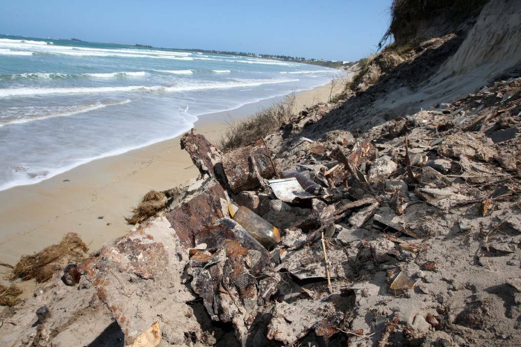 An eroded section of East Beach prior to rock wall fortification being built. Picture shows exposed landfill material from the former tip site.