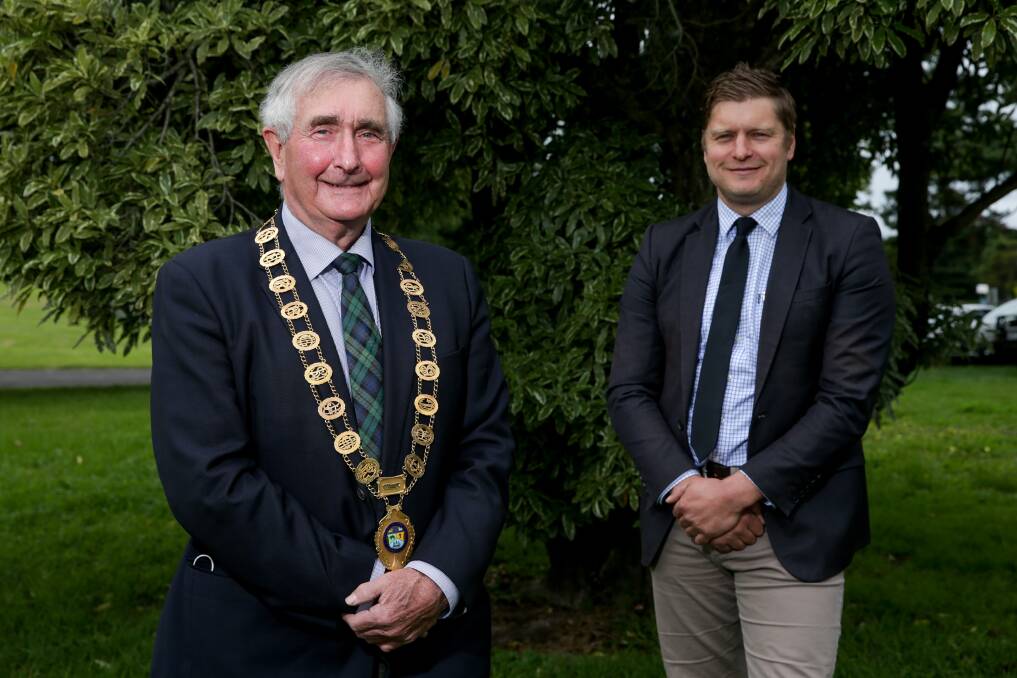 Stepping up: Cr Smith newly appointed and wearing the mayoral collar, along with his deputy and predecessor as mayor, Cr Daniel Meade. Picture: Chris Doheny.