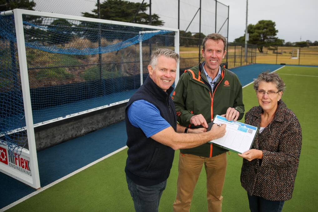 Aiming for goal: Federal Member for Wannon Dan Tehan, flanked by WDHA president Paul Dillon and Warrnambool City Council mayor Vicki Jellie. Picture: Morgan Hancock.
