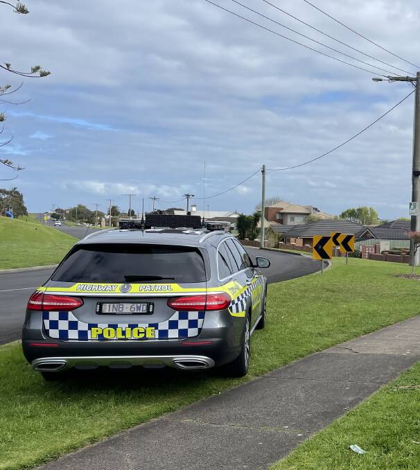Police and a senior team manager from the Warrnambool paramedic unit attend a siege on the western fringe of central Warrnambool. Picture by Ben Silvester