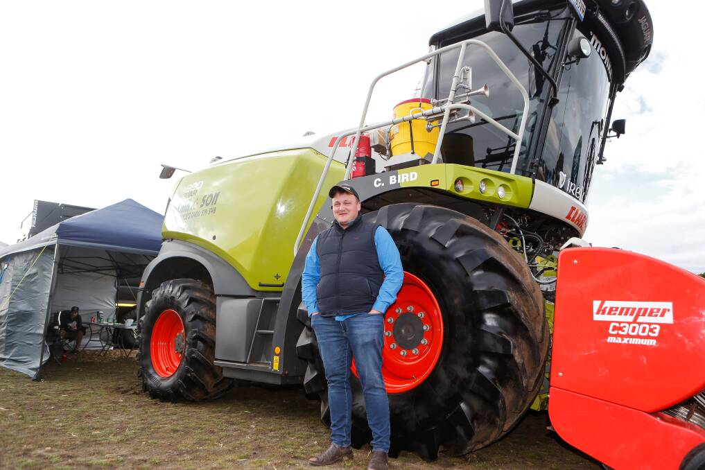 Riding high: Irishman Charley Bird in front of the huge tractor he drives for Monk & Son. Picture: Anthony Brady