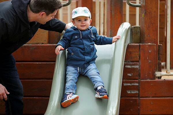 FUN: Jack Heaney, 1, heads down the slide during a short two-day trip from Melbourne. 