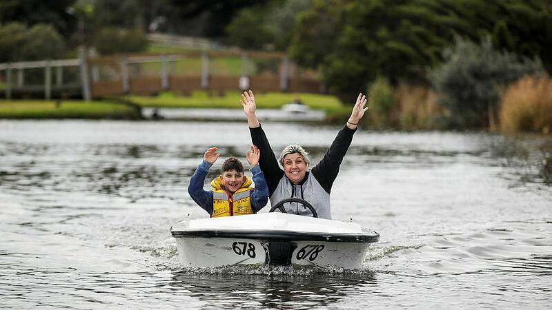 WINTER ESCAPE: Jordan Aggou, 8, and Vicky Aggou of Melbourne enjoy their time boating together on Lake Pertobe. They're one of the many families visiting Warrnambool during the school holidays instead of going interstate. 