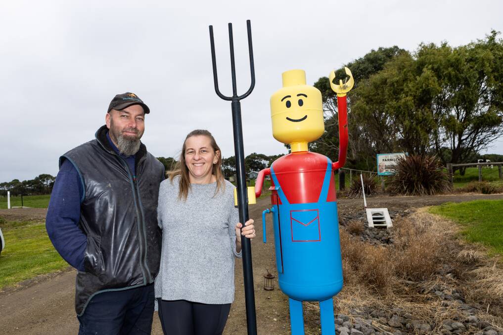 Curdievale's Andrew and Donna Bellis with their Lego Man letterbox. Picture by Anthony Brady