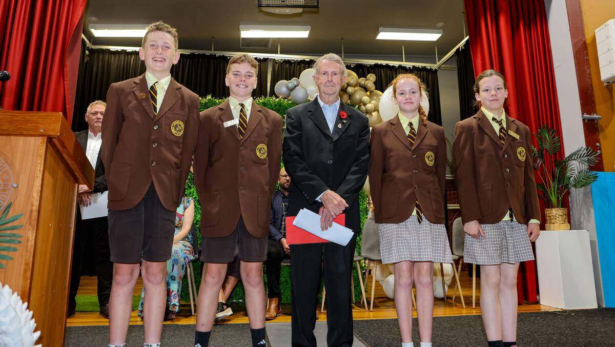 Warrnambool Primary School students Noah O'Connor, Jagger Lynch, Freya Earnshaw and Brianna Starick during a handover of a cheque to Vietnam veteran Ken Cummings. Picture by Anthony Brady