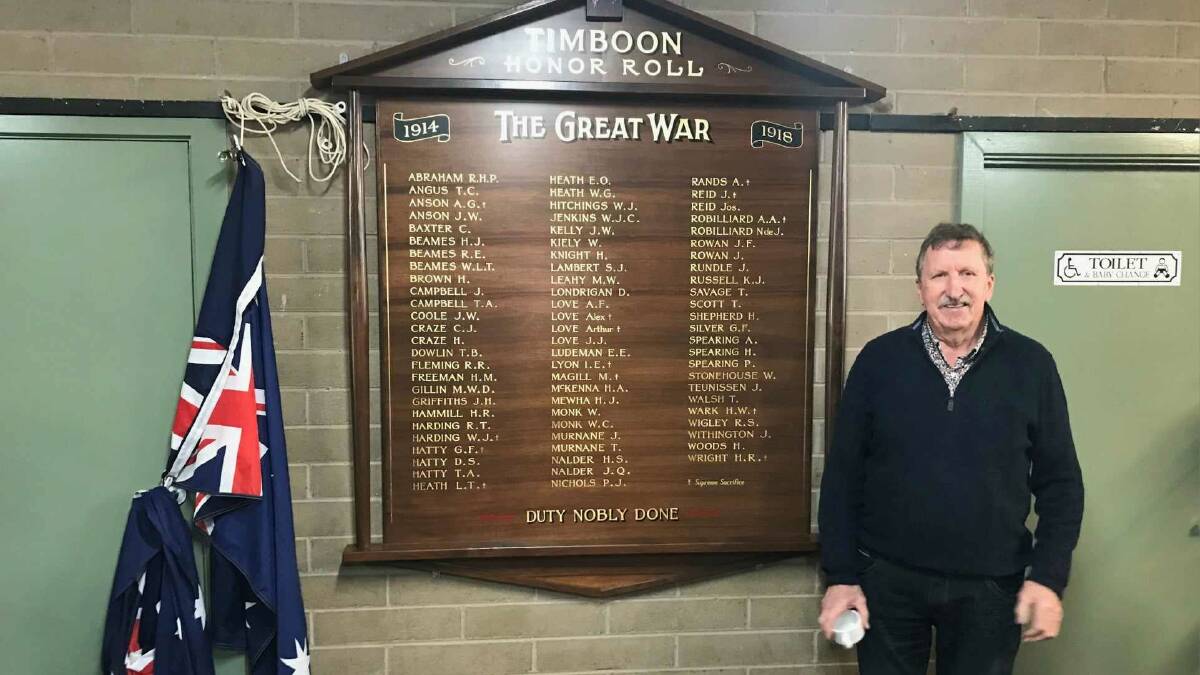 South-west craftsman Robert Marr stands next to the restored Timboon Honour Roll which he helped to build. Picture supplied.
