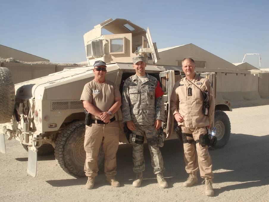 JOINT EFFORT: Steve Lamborn (right) with American forces in Afghanistan.