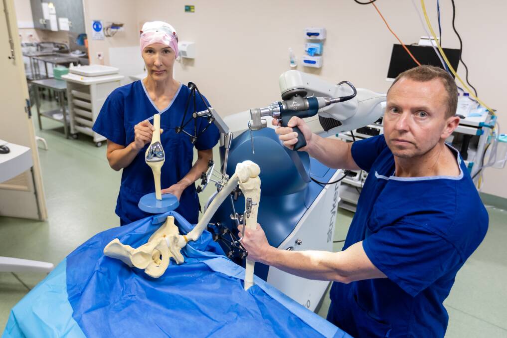 Registered nurse Mia Voigt and orthopaedic surgeon Nick Russell demonstrate the new robot at St John of God Warrnambool Hospital. Picture by Eddie Guerrero.