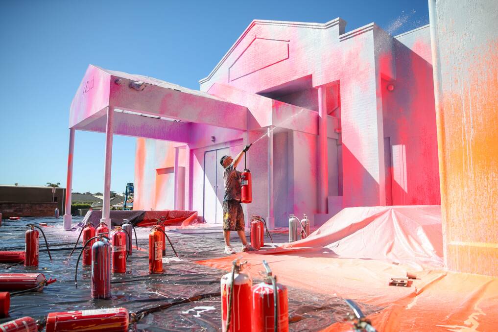 FREE REIGN: South-west artist Ash Keating spraying the WAG facade. Picture: Morgan Hancock