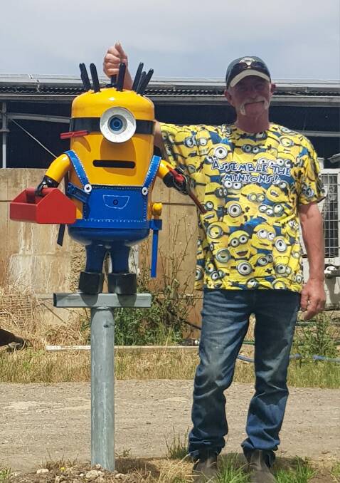 Peter Delaney with the couple's minion mailbox, named Stanley. 
