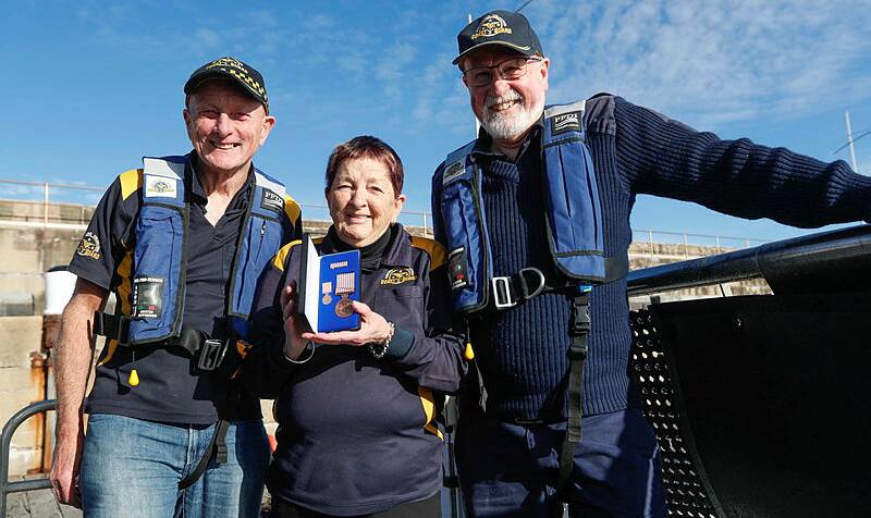 WELL DESERVED: Keith Prest, Barb Heazlewood and Allan Wood at the National Medal presentation. Founding member Barb has been with the Coast Guard for 17 years.