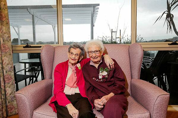 INSEPARABLE: Joyce McDonald, 88, and Mavis Trigg, 101, have known each other for 71 years. The two met in 1950 and celebrated Mavis' birthday together at Lyndoch Living, where an afternoon tea attended by fellow residents was held. 