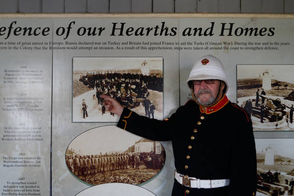 IN THE FAMILY: Garrison member Ken Ryan pointing out his great grandfather, Edward Carter.