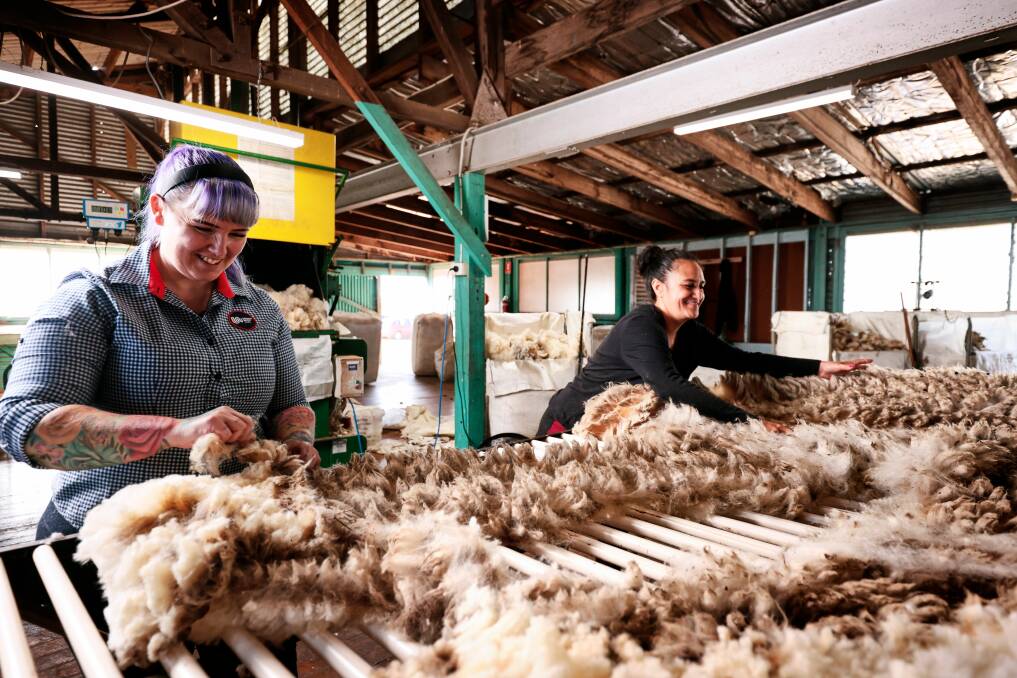 Wool classer-turned-teacher Sherri Symons from South West TAFE with student Krystal Churcher. Ms Symons says the role is in high demand as workforce shortages across the industry continue to bite.