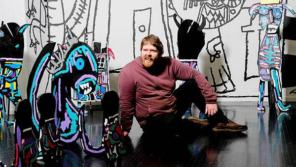 IMPROVISE: Artist Matthew Clarke painted several large murals throughout his exhibition at the Warrnambool Art Gallery without any pre-planning or use of stencil.