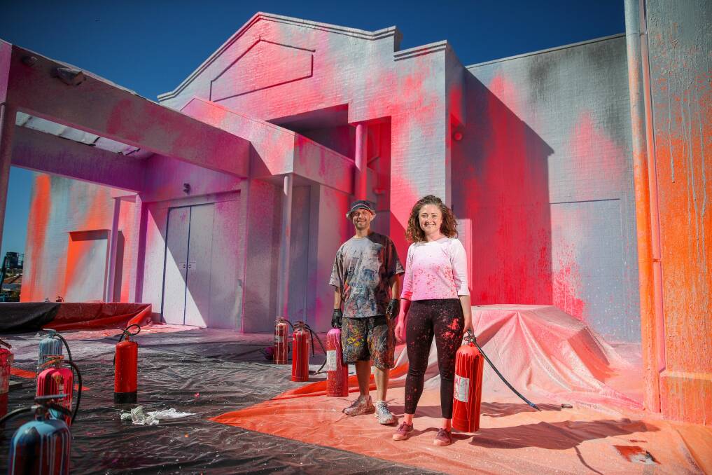 UNUSUAL: South-west artist Ash Keating and Warrnambool Art Gallery director Vanessa Gerrans in front of the 'Sunset Response' installation, part of Wallawar festival. Picture: Morgan Hancock