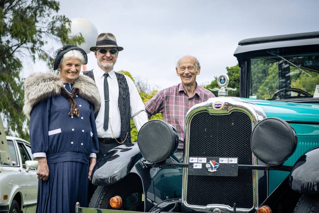 Warrnambool and District Historical Vehicle Club has hosted their 50th anniversary car show at the Fletcher Jones Gardens. Bev and Doug Byron of Allansford stand with their 1927 Oakley Coach, joined by club president Bryan O'Meara. Picture by Sean McKenna.