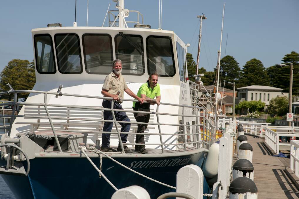 ON DECK: Southern Coast Charters skipper Barry Pender and helper Jake Hicks aboard the Southern Explorer. Tours do not set foot on the island. Picture: Chris Doheny