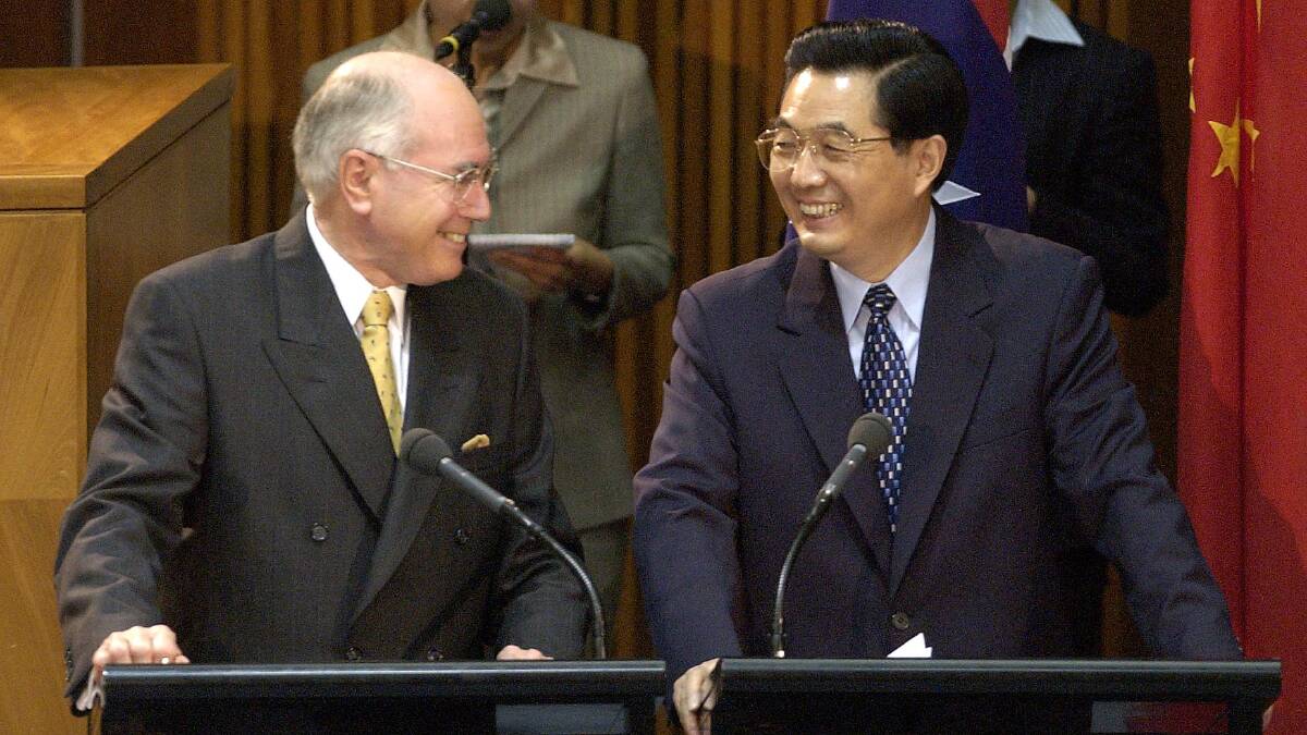 John Howard and Hu Jintao hold a joint press conference. Picture by Graham Tidy