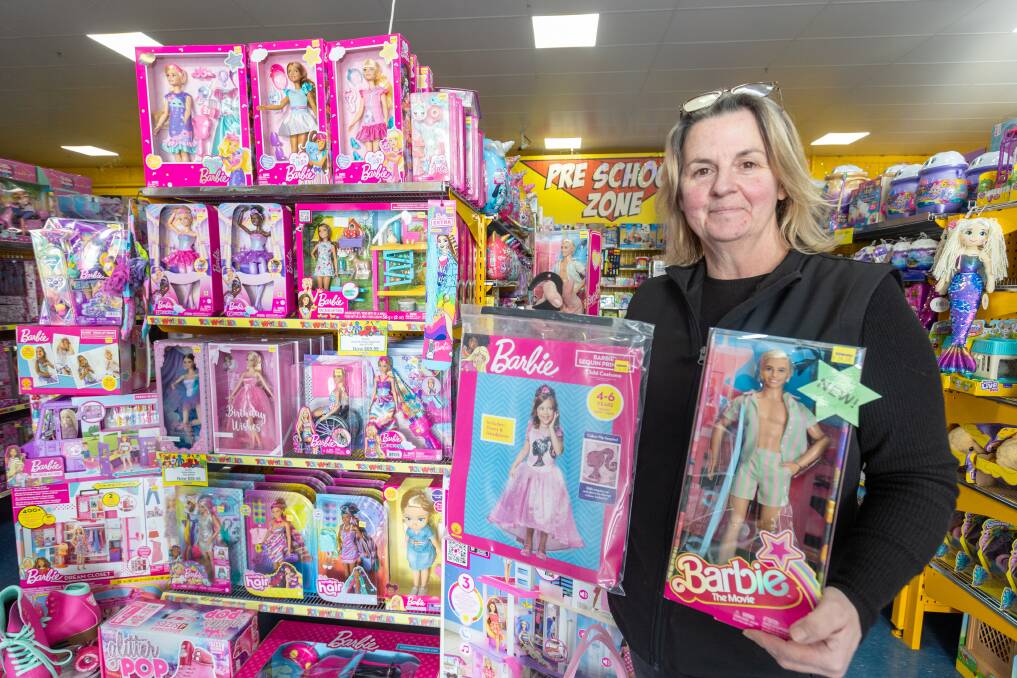 Toyworld Warrnambool owner and manager Karina Valente standing next to a range of Barbie dolls and merchandise. Picture by Eddie Guerrero