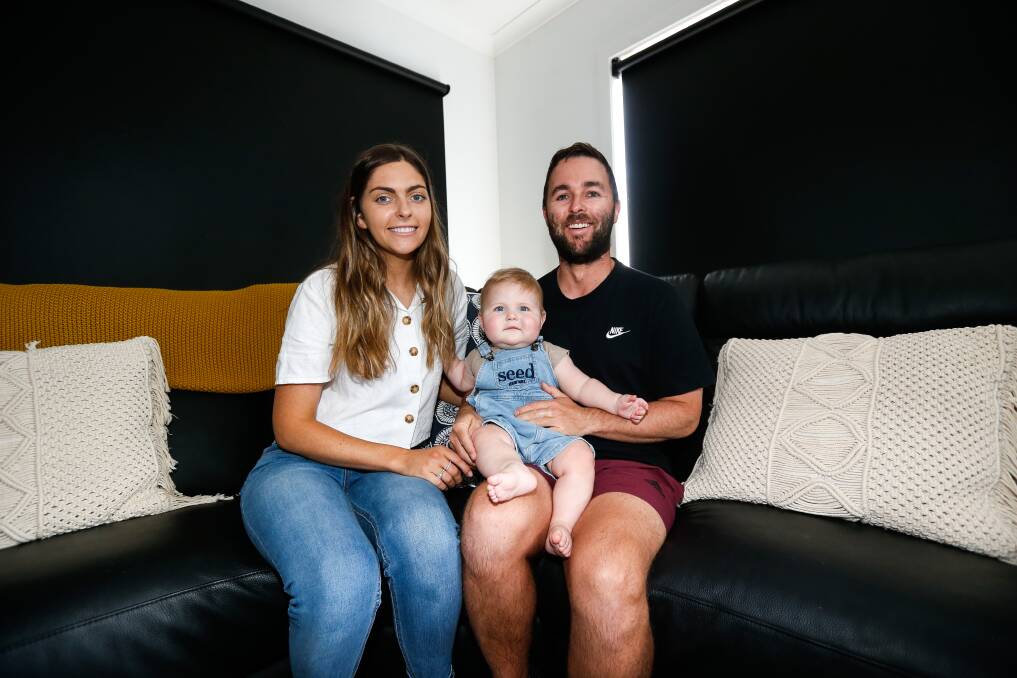 HEALTHY: A bubbly and healthier Paddy with parents Annie and Alastair Templeton. Picture: Anthony Brady