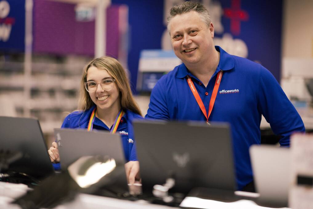 Officeworks staff member Amelie Plevier and store business manager Mark Ellis. Picture by Sean McKenna