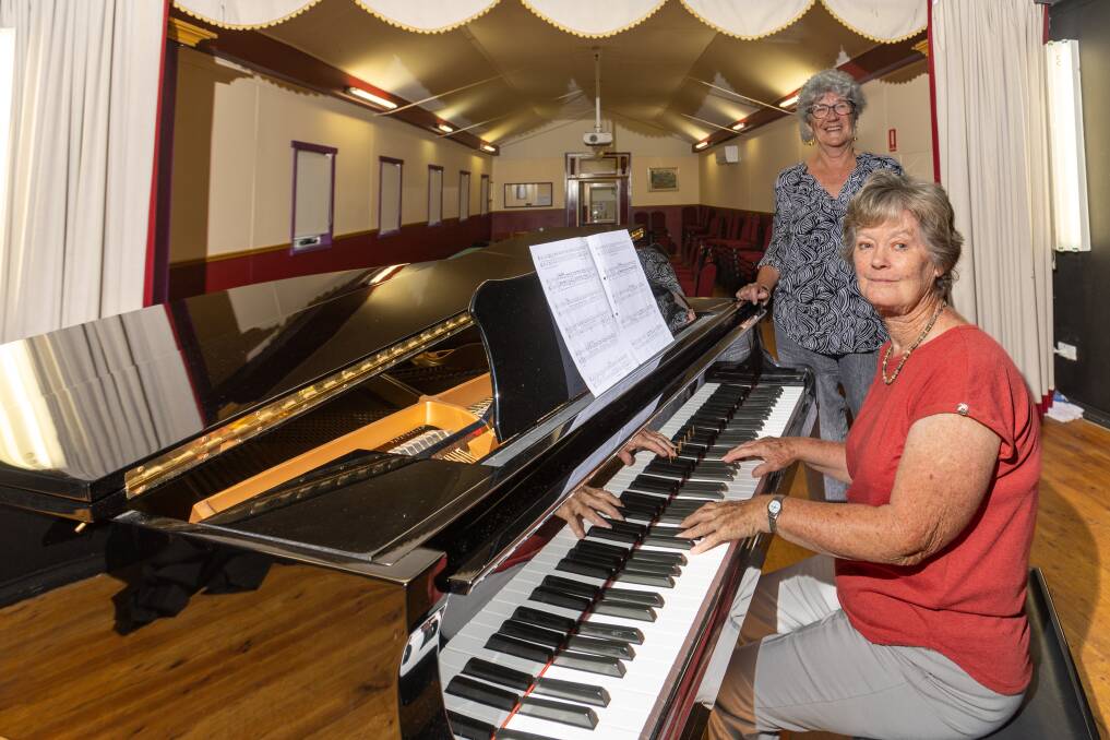 Warrnambool Eisteddfod's Paddy McGennisken and president Ann O'Brien, pictured playing the piano at Mozart Hall. Ms O'Brien said more volunteers are needed to replace retiring speech and drama conveners. Picture by Eddie Guerrero
