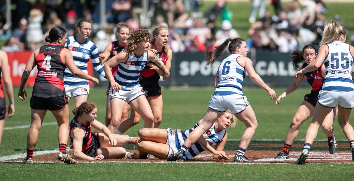 Geelong and Essendon players vie for the ball at Warrnambool's Reid Oval during an AFLW match in 2022. Picture by Sean McKenna 