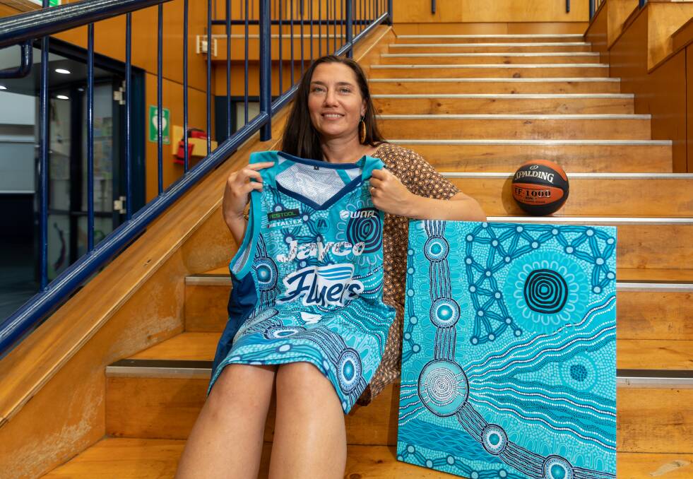 Warrnambool artist and proud Ngarrindjeri woman Emma Stenhouse with her artwork that adorns the WNBL's Indigenous round jerseys for Melbourne-based Southside Flyers. Picture by Eddie Guerrero