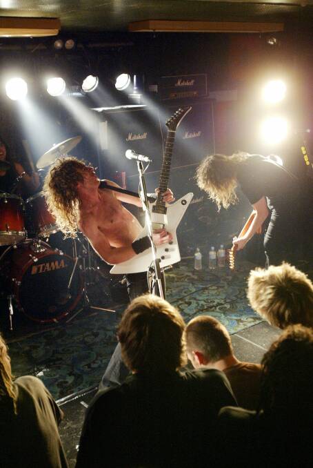LEFT: Airbourne performing at the Criteron Hotel in 2006 to a sold out crowd of 200 people.