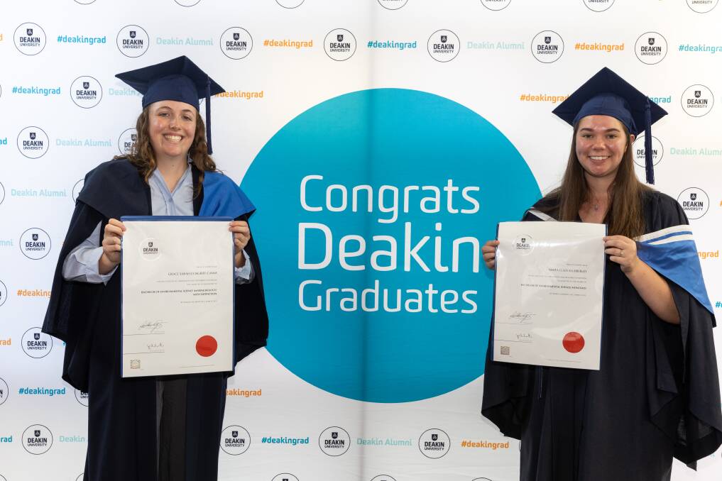 Grace Cosgriff-Camm and Nikita Dubberley are all smiles at the Deakin University Warrnambool campus graduation at the Lighthouse Theatre on Thursday, March 2. Picture by Eddie Guerrero