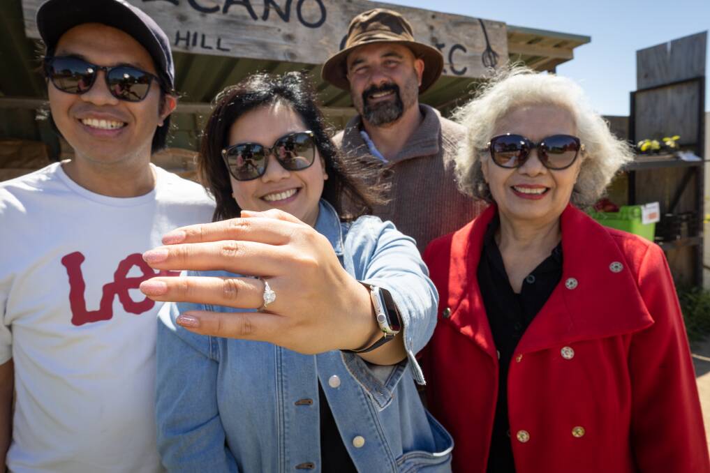 Alex Hutabrat and his wife Vivi Inamora and Vivi's mother Rosdiana Gurning and Volcano Produce farmer Ben Pohlner, back and the returned diamond ring. Picture by Sean McKenna