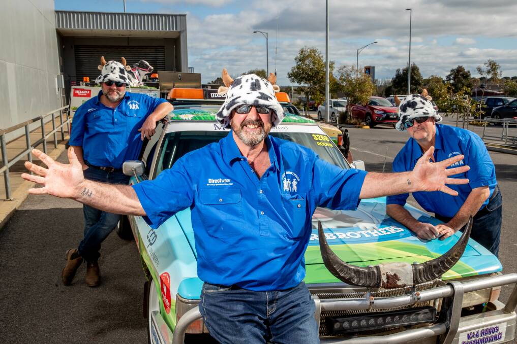 CHARITY RIDE: Variety Vic Bash Car 3268 Udder Brothers dairy farmers Brett Nutting, Leon Couch and Geoff Wickham. showing off their car at Gateway Plaza on Sunday. Picture: Chris Doheny