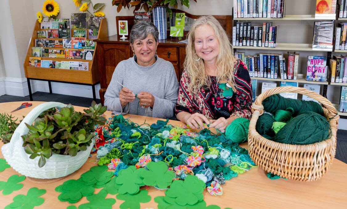 Rita Cassar and Loretta Gurnett are among those helping knit and crochet 5000 clovers, as part of a shamrock-a-thon, for the Koroit Irish Festival. Picture by Anthony Brady