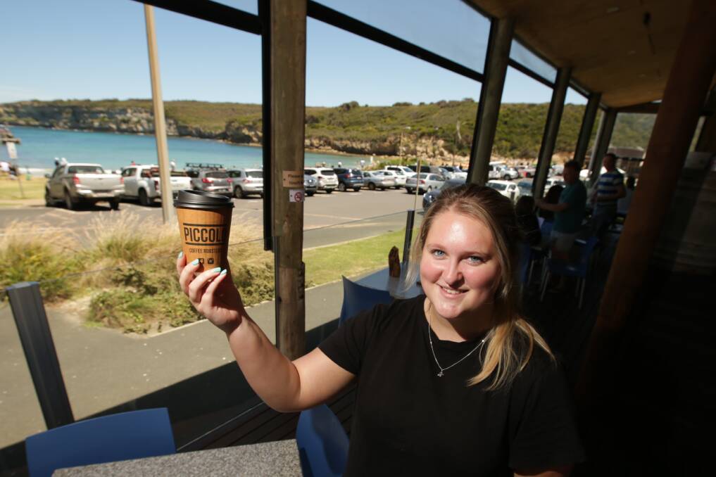 TOURISM: Waitresses like 12 Rocks Cafe and Beach Bar waitress Hannah Anderson are being swept off their feet with visitors to Port Campbell. Picture: Chris Doheny