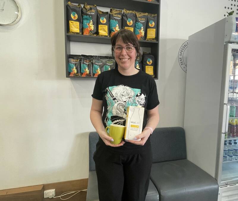 Monkey Business Coffee shop manager Jamie Taylor says an extra public holiday would impact on staff work hours . She is showcased here holding a mug and milk. Picture by Lillian Altman
