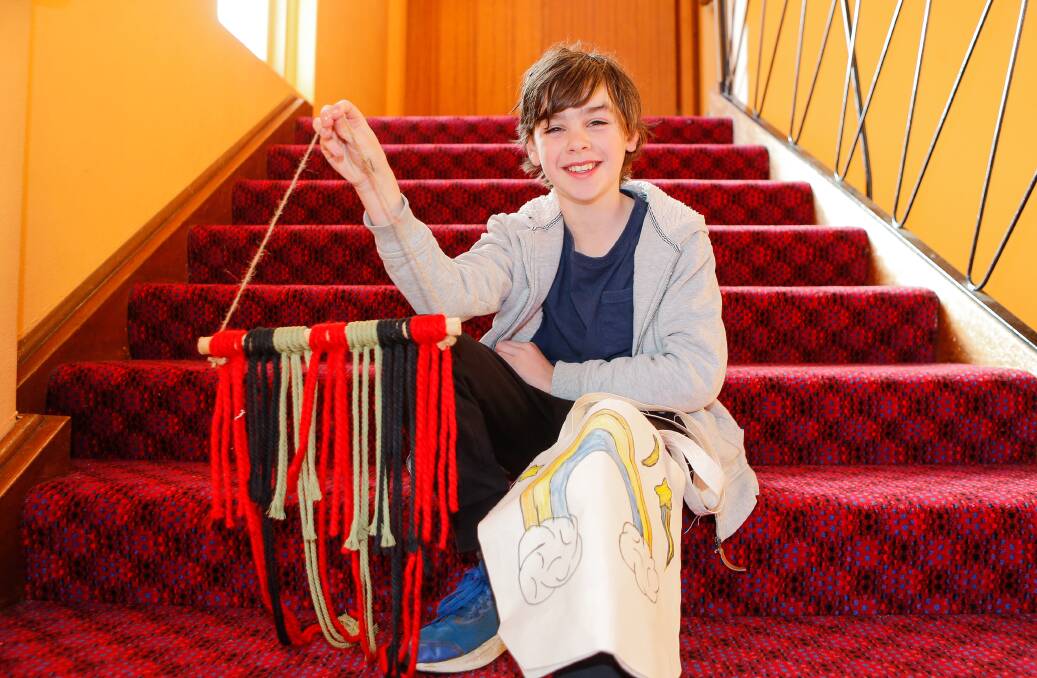CRAFTERNOON: William Lane, 10, is helping his mother Renee with the crafty kids fun fair running at Koroit Theatre on Thursday. Activities include macrame, wall hangings, painting and cookie making. Picture: Anthony Brady