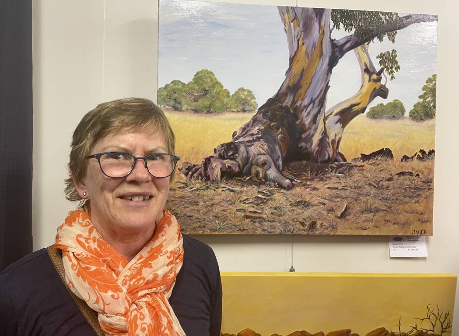 AWARDS: Jenny Vick with her Warrnambool and District Artists' Society's Annual Awards overall winning piece Down Blackwood Road. It was selected from more than 100 artworks. Picture: Lillian Altman