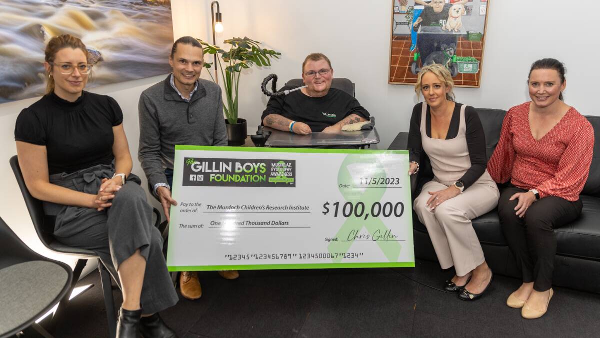 Chris Gillin with representatives from Murdoch Children's Research Institute at the Gillin Boys Foundation cheque presentation on Thursday. Picture by Eddie Guerrero