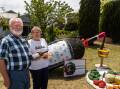 Tarrington residents Colin and Betty Huf with their award-winning German mulled wine and cheese platter hay bale display. Picture by Eddie Guerrero