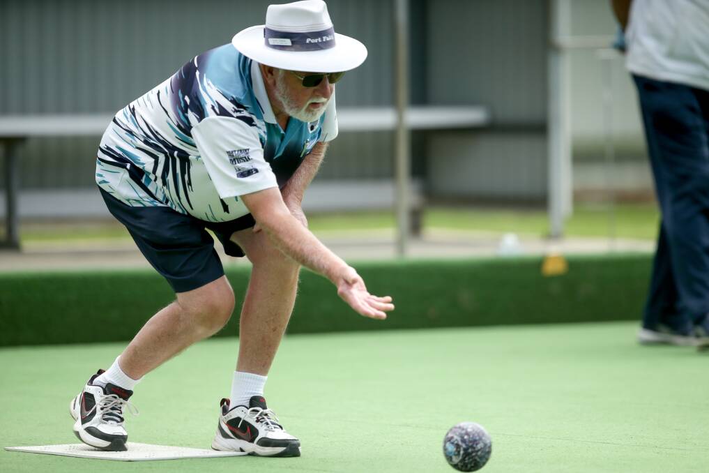 TEST OF WILLS: Port Fairy's Alan Parker puts down a shot during the team's round 12 midweek pennant clash against Koroit. Pictures: Chris Doheny