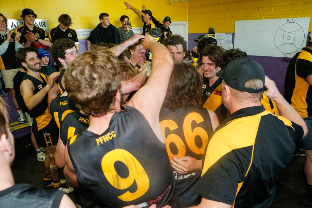 Portland players celebrate in the rooms after its first Hampden league finals win.