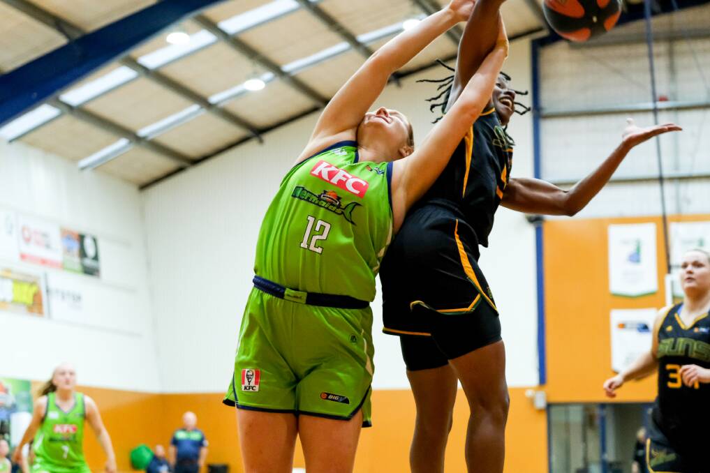 BATTLE: Warrnambool's Keele Hillas tangles with Sherbrooke import Ariel Hearn the last time the two teams met last month. Picture: Chris Doheny