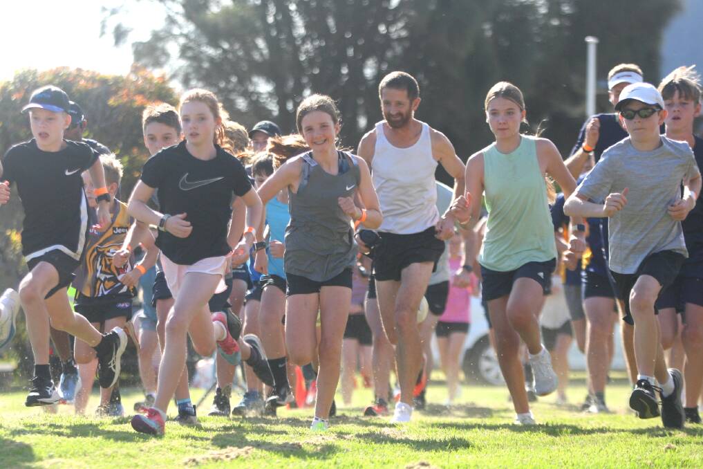 Rose Jarvis (middle) was all smiles as she takes off for the 5km run. Picture by Meg Saultry