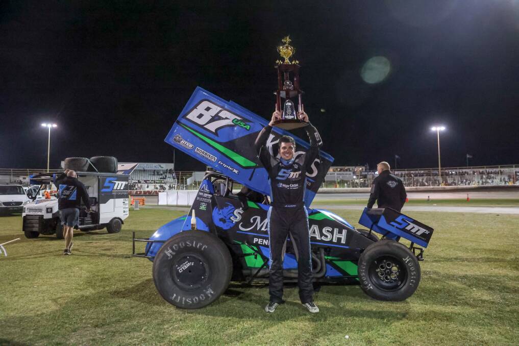 Aaron Reutzel hoists the Grand Annual Sprintcar Classic trophy on Sunday night. Picture by Eddie Guerrero.