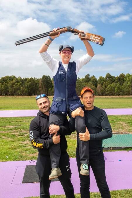 Penny Smith (middle) celebrates shooting 125/125 at Lilydale. She joins Nidal Asmar (right) in holding the Australian ISSF Olympic Trap record. Picture supplied.