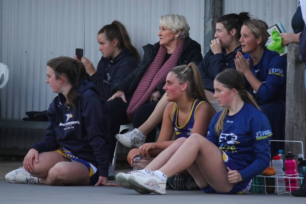 LEGEND: Norma Plummer (middle) on the bench with North Warrnambool players during Saturday's open grade clash with South Warrnambool. Picture: Morgan Hancock