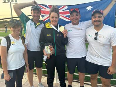 Penny Smith (middle) celebrates her World Cup gold medal in Qatar. Picture by Shooting Australia