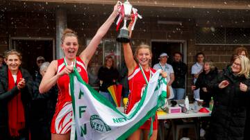 South co-captains Annie Blackburn and Carly Watson hoist last year's breakthrough open grade premiership. Picture by Rob Gunstone